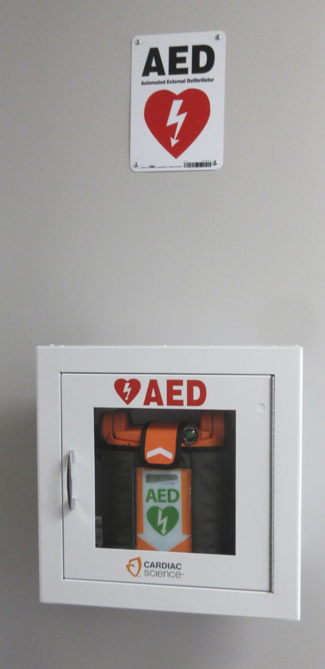 A public automated external defibrillator in a wall compartment